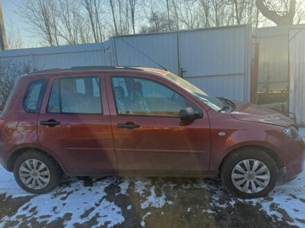 Красный Мазда 2, объемом двигателя 1.3 л и пробегом 164 тыс. км за 3500 $, фото 1 на Automoto.ua