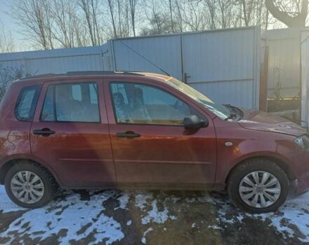Красный Мазда 2, объемом двигателя 1.3 л и пробегом 164 тыс. км за 3500 $, фото 1 на Automoto.ua
