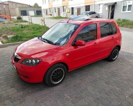 Красный Мазда 2, объемом двигателя 1.4 л и пробегом 250 тыс. км за 2999 $, фото 1 на Automoto.ua