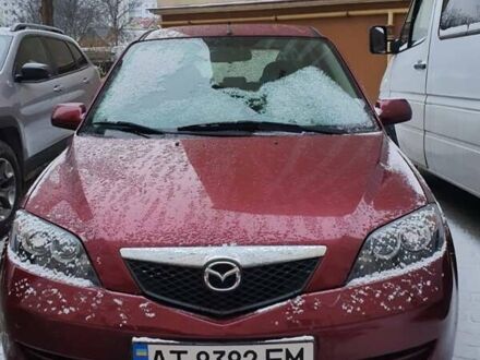 Червоний Мазда 2, об'ємом двигуна 1.4 л та пробігом 170 тис. км за 4200 $, фото 1 на Automoto.ua