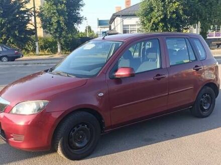 Червоний Мазда 2, об'ємом двигуна 1.4 л та пробігом 305 тис. км за 3600 $, фото 1 на Automoto.ua
