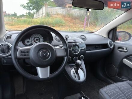 Красный Мазда 2, объемом двигателя 1.5 л и пробегом 124 тыс. км за 5500 $, фото 1 на Automoto.ua
