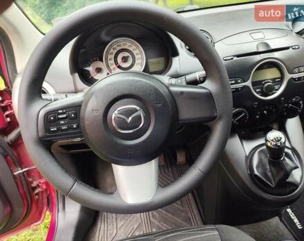 Червоний Мазда 2, об'ємом двигуна 1.35 л та пробігом 180 тис. км за 5200 $, фото 1 на Automoto.ua