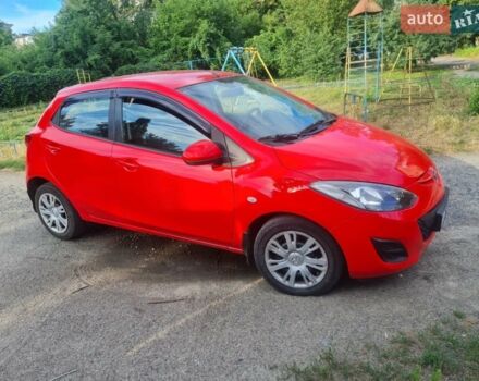 Красный Мазда 2, объемом двигателя 1.5 л и пробегом 176 тыс. км за 5800 $, фото 1 на Automoto.ua