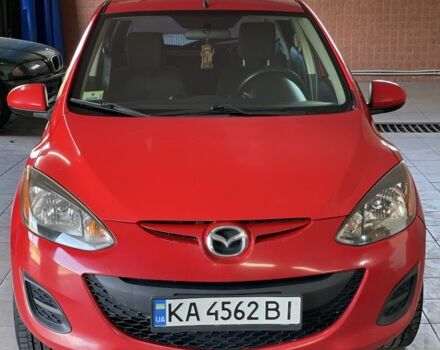 Красный Мазда 2, объемом двигателя 1.5 л и пробегом 160 тыс. км за 5699 $, фото 1 на Automoto.ua