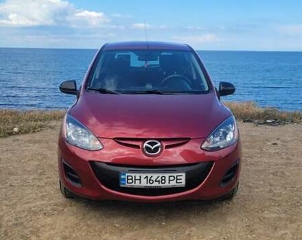 Красный Мазда 2, объемом двигателя 1.5 л и пробегом 52 тыс. км за 7700 $, фото 1 на Automoto.ua