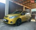 Желтый Мазда 2, объемом двигателя 1.5 л и пробегом 135 тыс. км за 7000 $, фото 1 на Automoto.ua