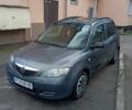Сірий Мазда 2, об'ємом двигуна 1.4 л та пробігом 202 тис. км за 2499 $, фото 1 на Automoto.ua