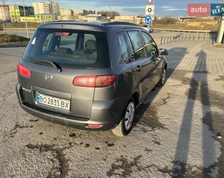 Серый Мазда 2, объемом двигателя 1.39 л и пробегом 120 тыс. км за 2999 $, фото 1 на Automoto.ua