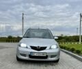 Серый Мазда 2, объемом двигателя 1.4 л и пробегом 322 тыс. км за 3700 $, фото 1 на Automoto.ua