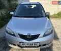 Серый Мазда 2, объемом двигателя 1.4 л и пробегом 209 тыс. км за 3200 $, фото 1 на Automoto.ua