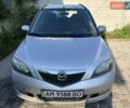 Серый Мазда 2, объемом двигателя 1.4 л и пробегом 209 тыс. км за 3200 $, фото 1 на Automoto.ua
