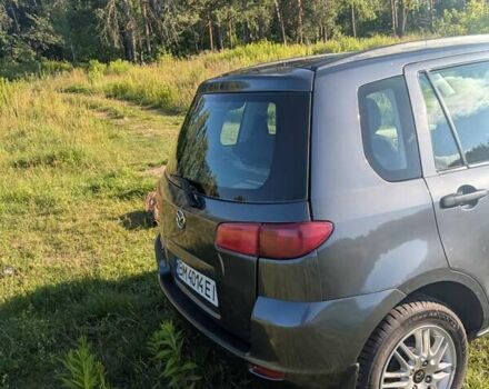 Серый Мазда 2, объемом двигателя 1.4 л и пробегом 187 тыс. км за 5500 $, фото 1 на Automoto.ua