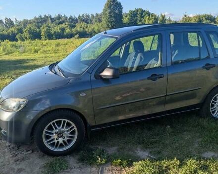 Серый Мазда 2, объемом двигателя 1.4 л и пробегом 187 тыс. км за 5500 $, фото 2 на Automoto.ua