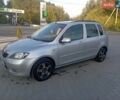 Сірий Мазда 2, об'ємом двигуна 1.4 л та пробігом 335 тис. км за 2499 $, фото 1 на Automoto.ua