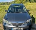 Серый Мазда 2, объемом двигателя 1.4 л и пробегом 187 тыс. км за 5500 $, фото 1 на Automoto.ua