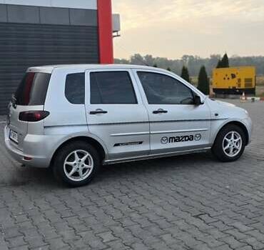 Сірий Мазда 2, об'ємом двигуна 1.4 л та пробігом 226 тис. км за 4350 $, фото 4 на Automoto.ua