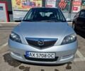 Серый Мазда 2, объемом двигателя 1.4 л и пробегом 166 тыс. км за 3900 $, фото 1 на Automoto.ua