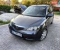 Сірий Мазда 2, об'ємом двигуна 1.39 л та пробігом 220 тис. км за 4799 $, фото 1 на Automoto.ua