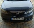 Серый Мазда 2, объемом двигателя 1.4 л и пробегом 190 тыс. км за 4850 $, фото 1 на Automoto.ua
