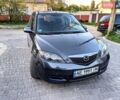 Сірий Мазда 2, об'ємом двигуна 1.39 л та пробігом 220 тис. км за 4799 $, фото 2 на Automoto.ua
