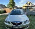 Серый Мазда 2, объемом двигателя 2 л и пробегом 249 тыс. км за 4200 $, фото 1 на Automoto.ua