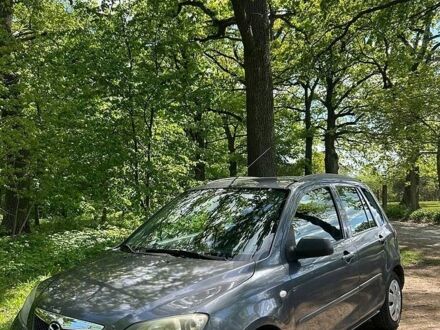 Сірий Мазда 2, об'ємом двигуна 1.4 л та пробігом 150 тис. км за 2800 $, фото 1 на Automoto.ua