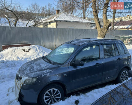 Серый Мазда 2, объемом двигателя 1.4 л и пробегом 200 тыс. км за 3200 $, фото 1 на Automoto.ua