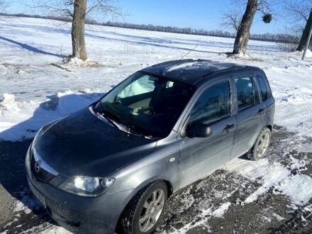 Сірий Мазда 2, об'ємом двигуна 1.4 л та пробігом 253 тис. км за 3300 $, фото 1 на Automoto.ua