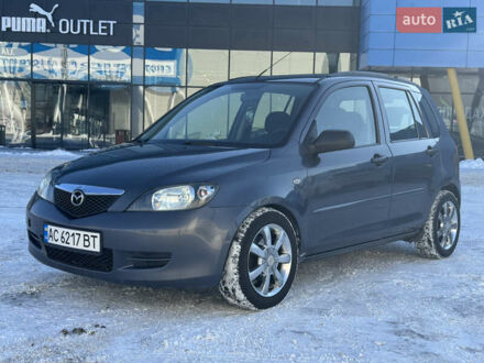 Серый Мазда 2, объемом двигателя 1.4 л и пробегом 254 тыс. км за 3500 $, фото 1 на Automoto.ua