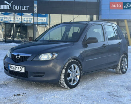 Серый Мазда 2, объемом двигателя 1.4 л и пробегом 254 тыс. км за 3500 $, фото 1 на Automoto.ua