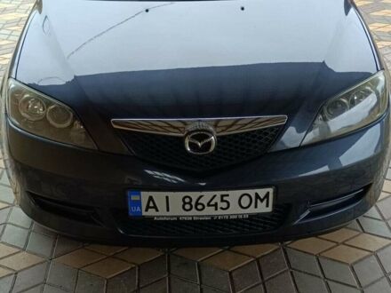 Серый Мазда 2, объемом двигателя 1.4 л и пробегом 190 тыс. км за 4850 $, фото 1 на Automoto.ua