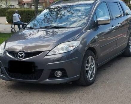 Сірий Мазда 2, об'ємом двигуна 2 л та пробігом 236 тис. км за 8224 $, фото 1 на Automoto.ua