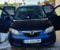Синий Мазда 2, объемом двигателя 1.4 л и пробегом 255 тыс. км за 3800 $, фото 1 на Automoto.ua