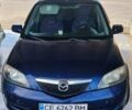 Синій Мазда 2, об'ємом двигуна 1.4 л та пробігом 255 тис. км за 3800 $, фото 1 на Automoto.ua