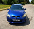 Синий Мазда 2, объемом двигателя 1.5 л и пробегом 185 тыс. км за 5500 $, фото 1 на Automoto.ua