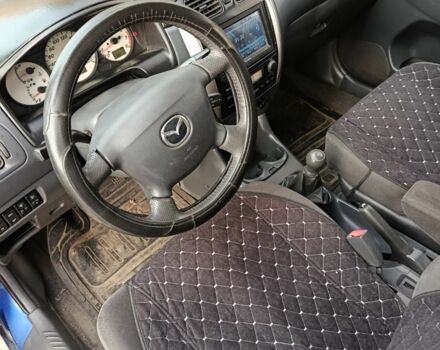 Синий Мазда 2, объемом двигателя 1.8 л и пробегом 318 тыс. км за 3000 $, фото 7 на Automoto.ua