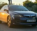 Синий Мазда 2, объемом двигателя 2 л и пробегом 205 тыс. км за 4014 $, фото 1 на Automoto.ua