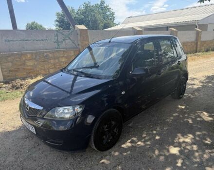 Синий Мазда 2, объемом двигателя 1.4 л и пробегом 208 тыс. км за 3850 $, фото 1 на Automoto.ua