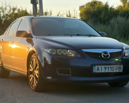 Синий Мазда 2, объемом двигателя 2 л и пробегом 205 тыс. км за 4014 $, фото 1 на Automoto.ua