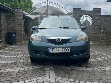 Зелений Мазда 2, об'ємом двигуна 1.4 л та пробігом 138 тис. км за 3800 $, фото 1 на Automoto.ua