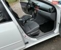 Белый Мазда 3, объемом двигателя 1.59 л и пробегом 305 тыс. км за 4900 $, фото 81 на Automoto.ua