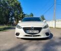 Белый Мазда 3, объемом двигателя 2 л и пробегом 141 тыс. км за 9600 $, фото 1 на Automoto.ua