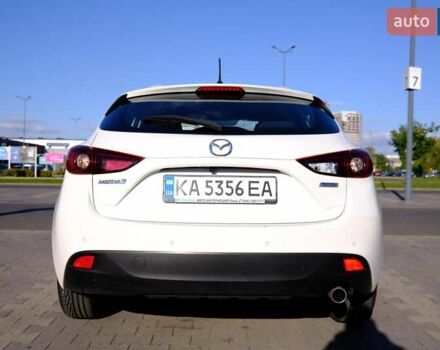 Білий Мазда 3, об'ємом двигуна 1.5 л та пробігом 74 тис. км за 14500 $, фото 3 на Automoto.ua
