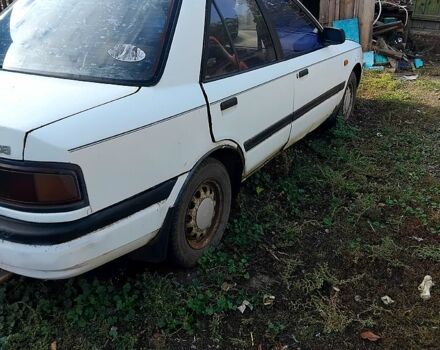 Белый Мазда 3, объемом двигателя 1.7 л и пробегом 300 тыс. км за 600 $, фото 4 на Automoto.ua