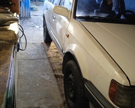 Белый Мазда 3, объемом двигателя 1.5 л и пробегом 333 тыс. км за 473 $, фото 3 на Automoto.ua