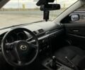 Белый Мазда 3, объемом двигателя 2 л и пробегом 182 тыс. км за 7100 $, фото 3 на Automoto.ua