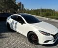 Белый Мазда 3, объемом двигателя 2 л и пробегом 157 тыс. км за 12599 $, фото 1 на Automoto.ua