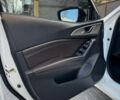 Білий Мазда 3, об'ємом двигуна 2 л та пробігом 63 тис. км за 13700 $, фото 20 на Automoto.ua