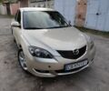 Бежевый Мазда 3, объемом двигателя 1.6 л и пробегом 250 тыс. км за 4550 $, фото 1 на Automoto.ua